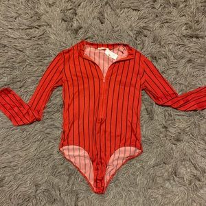 Black and red zip up body suit